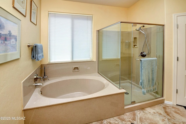 full bath with a shower stall, a bath, and tile patterned floors