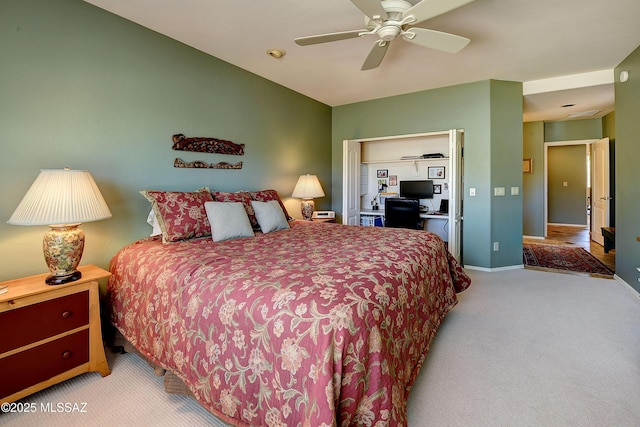 carpeted bedroom with lofted ceiling, baseboards, and a ceiling fan