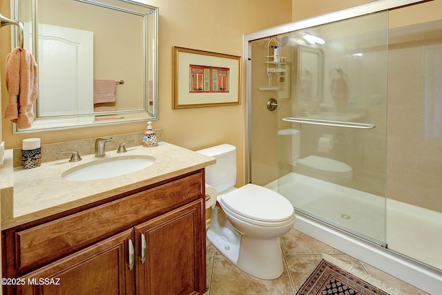 full bath featuring toilet, a shower stall, tile patterned flooring, and vanity