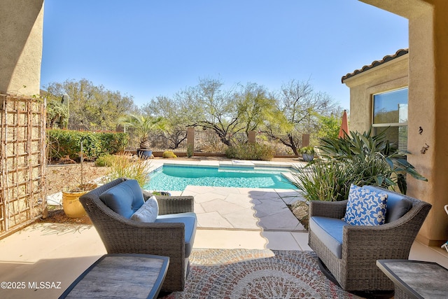 view of swimming pool featuring a fenced in pool, a fenced backyard, and a patio