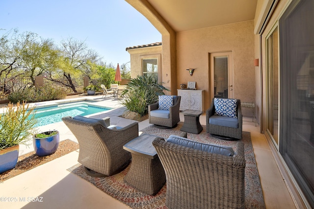 view of patio / terrace featuring a fenced in pool and fence