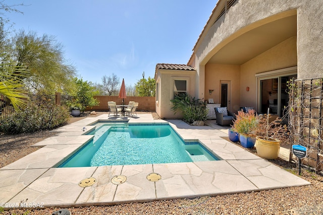 view of pool featuring a patio area, a fenced backyard, a fenced in pool, and outdoor dining space