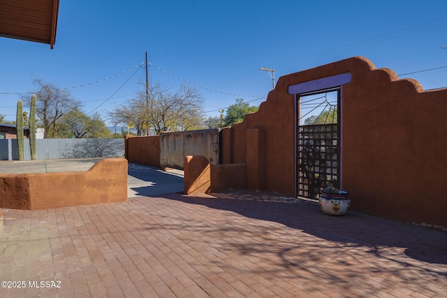 view of patio featuring fence