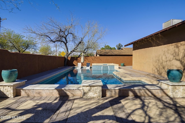 view of swimming pool featuring a fenced in pool, an in ground hot tub, and a fenced backyard