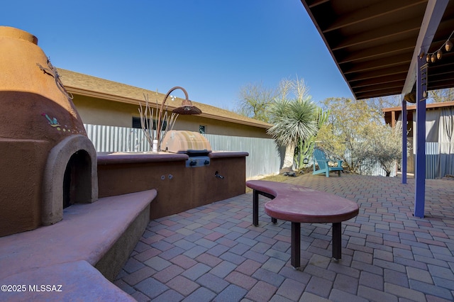 view of patio featuring fence