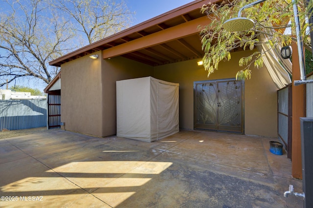 view of patio / terrace featuring fence