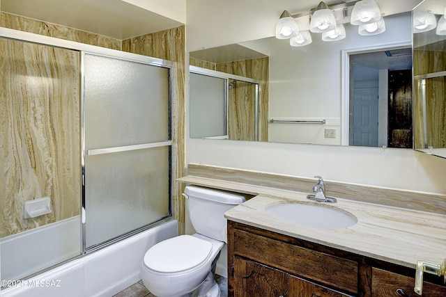 35 E Pastime Rd, Tucson, AZ 85705 - bathroom featuring toilet, combined bath / shower with glass door, and vanity
