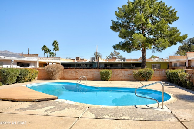 35 E Pastime Rd, Tucson, AZ 85705 - view of swimming pool with a patio area, a fenced backyard, and a fenced in pool