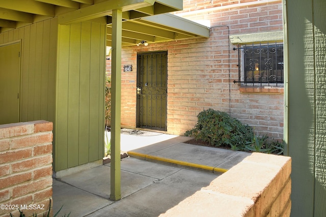 35 E Pastime Rd, Tucson, AZ 85705 - doorway to property with brick siding
