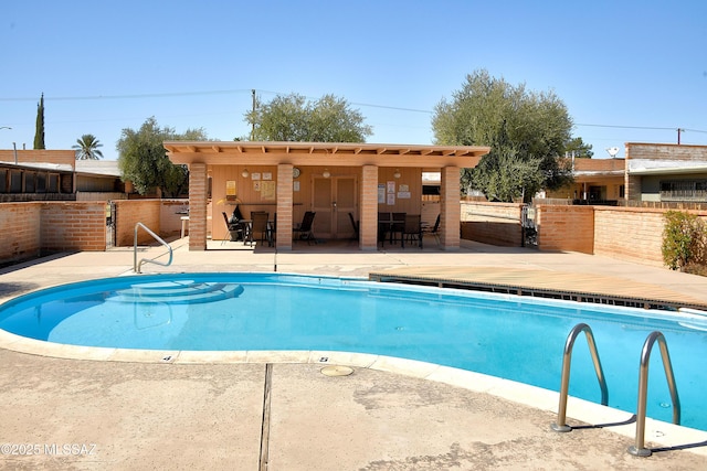 35 E Pastime Rd, Tucson, AZ 85705 - community pool featuring a patio and fence