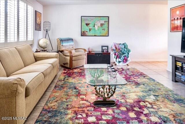 35 E Pastime Rd, Tucson, AZ 85705 - tiled living area featuring baseboards