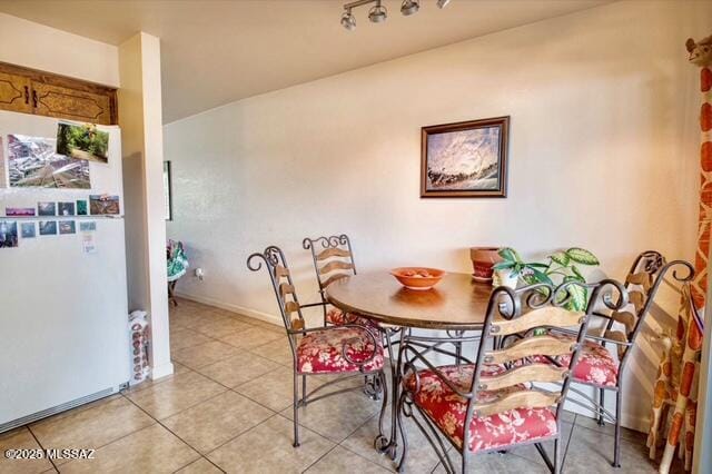 35 E Pastime Rd, Tucson, AZ 85705 - dining area with light tile patterned flooring and baseboards