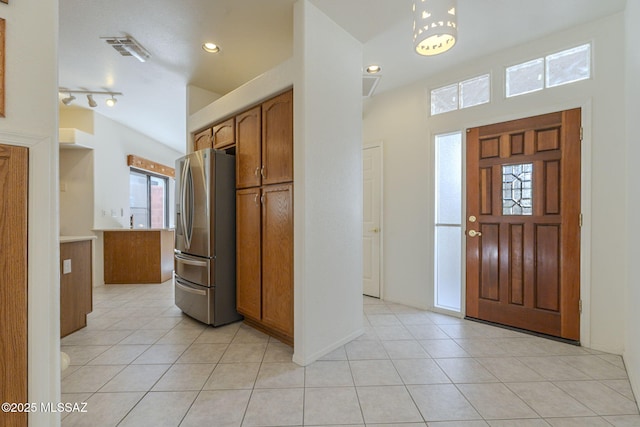 foyer entrance with light tile patterned floors, visible vents, track lighting, and recessed lighting