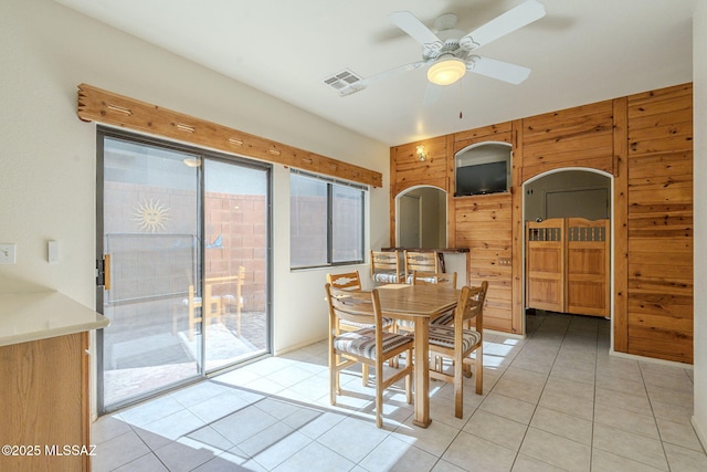 dining room featuring light tile patterned floors, a wealth of natural light, and visible vents