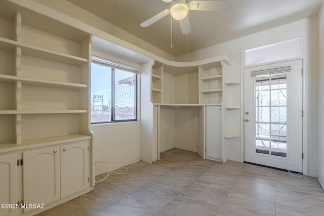 interior space with a ceiling fan