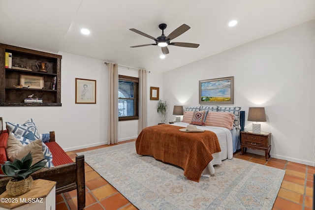 bedroom featuring vaulted ceiling, baseboards, and recessed lighting