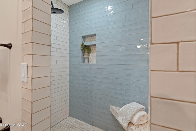 bathroom featuring tiled shower