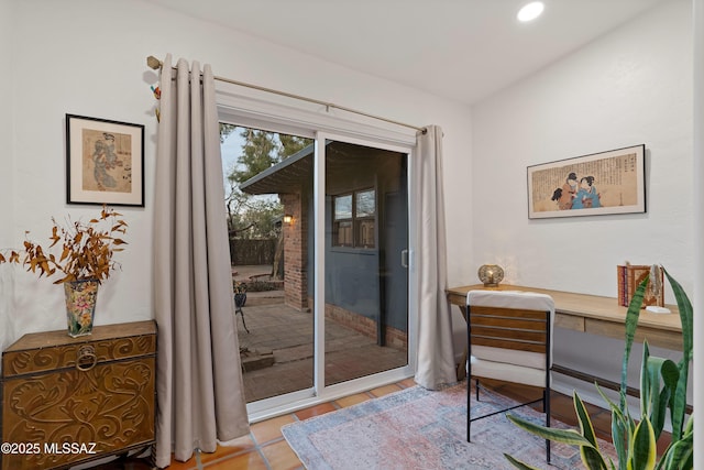 doorway to outside featuring recessed lighting and tile patterned floors