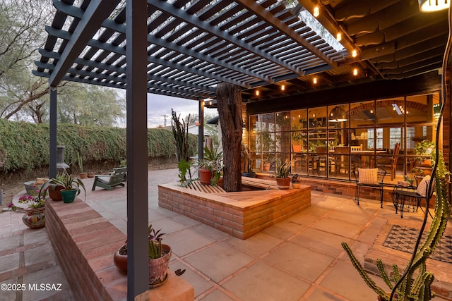 view of patio with fence and a pergola