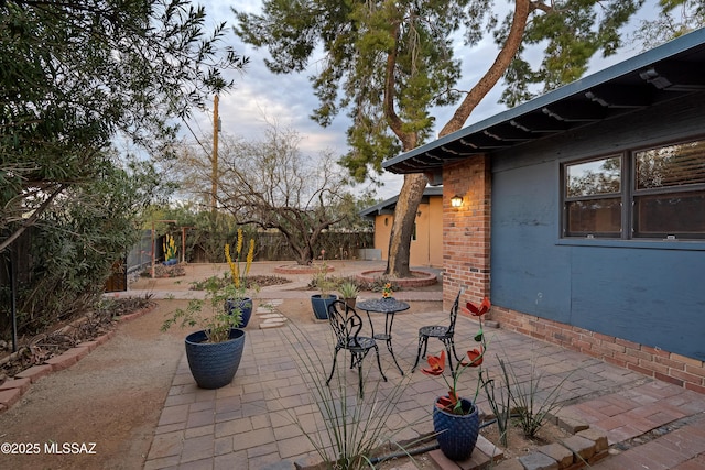 view of patio / terrace featuring fence