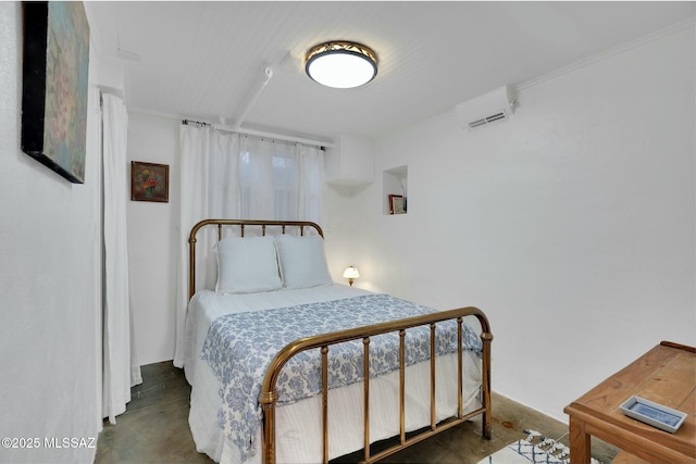 bedroom with concrete floors and a wall mounted AC