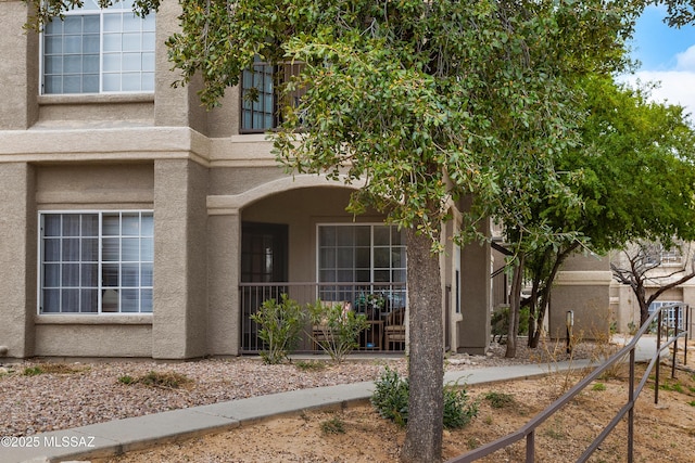 view of side of property with stucco siding