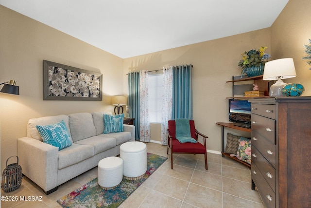 living room with baseboards and light tile patterned floors