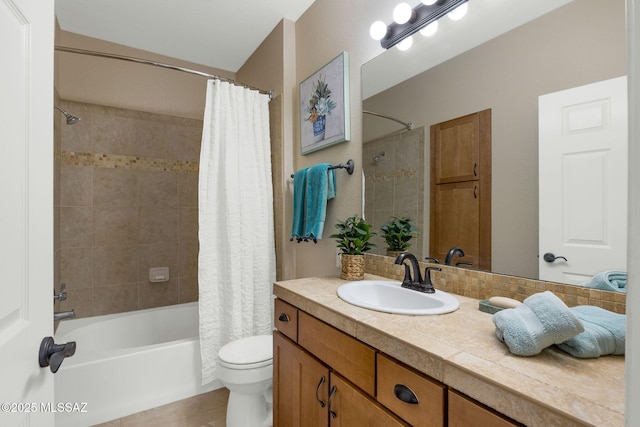 full bathroom featuring toilet, shower / tub combo with curtain, and vanity