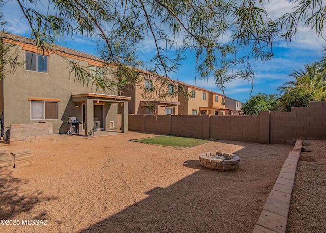 14298 S Camino El Galan, Sahuarita, AZ 85629 - fenced backyard featuring a fire pit and a patio