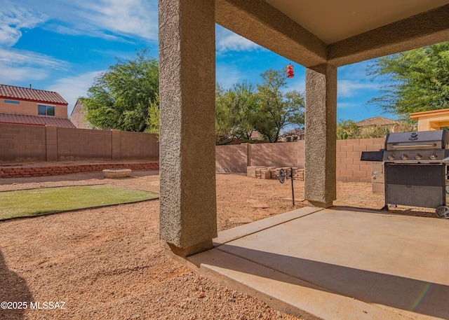 14298 S Camino El Galan, Sahuarita, AZ 85629 - view of patio featuring a fenced backyard and grilling area