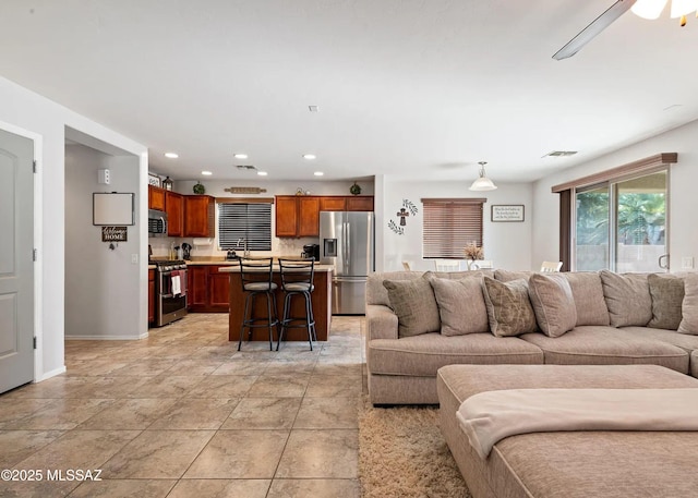 14298 S Camino El Galan, Sahuarita, AZ 85629 - living room with recessed lighting, baseboards, and a ceiling fan
