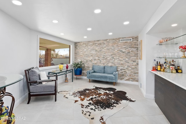 living area with a dry bar, recessed lighting, visible vents, baseboards, and tile patterned floors