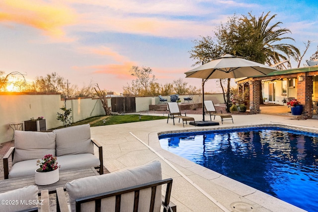 view of pool with a patio area, a fenced backyard, an outdoor hangout area, and a fenced in pool