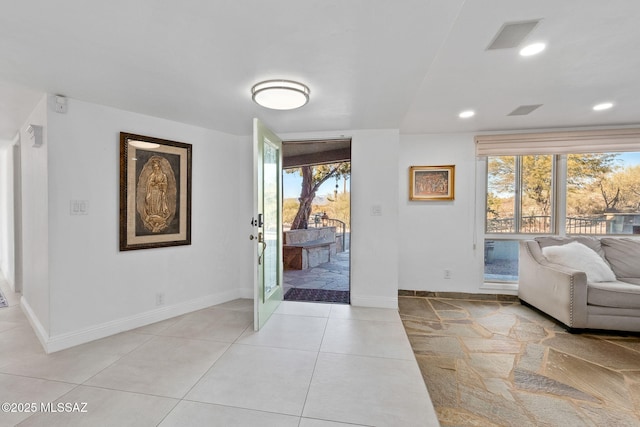 foyer entrance featuring recessed lighting, visible vents, baseboards, and light tile patterned floors