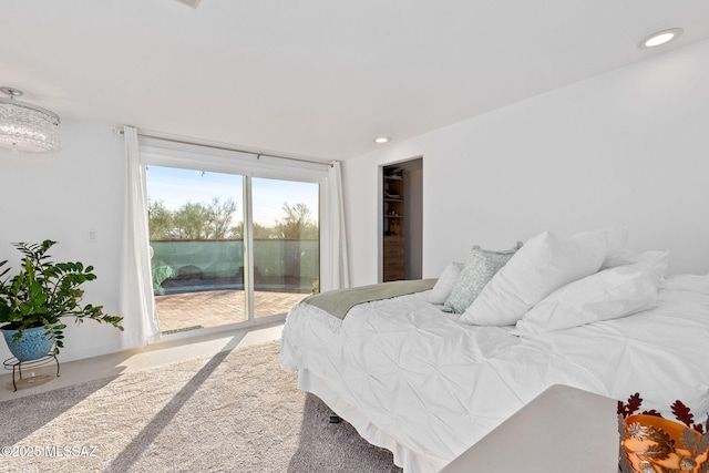 bedroom featuring access to outside, carpet, and recessed lighting