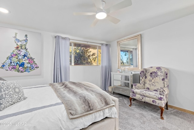 carpeted bedroom with baseboards and a ceiling fan