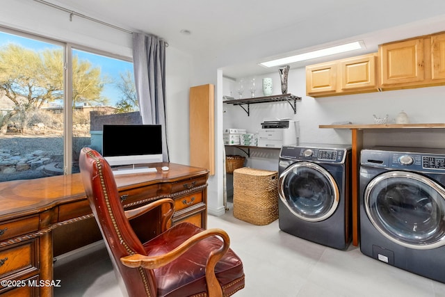 laundry room with washing machine and dryer