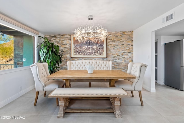 dining area featuring breakfast area, light tile patterned flooring, visible vents, and a notable chandelier