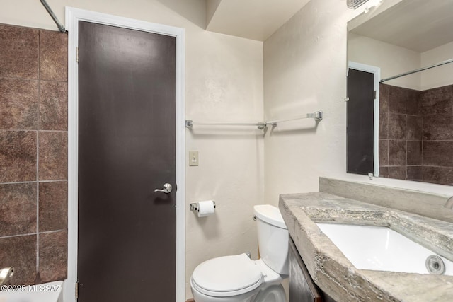 bathroom with toilet, walk in shower, and vanity