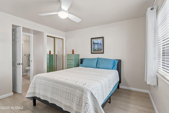 bedroom featuring a closet, light wood-type flooring, a ceiling fan, and baseboards