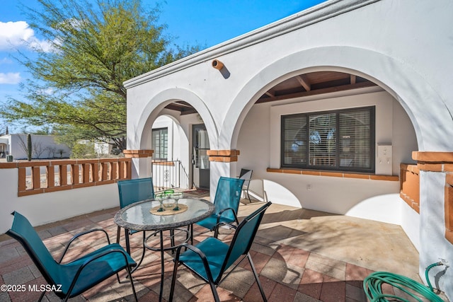 view of patio with outdoor dining area