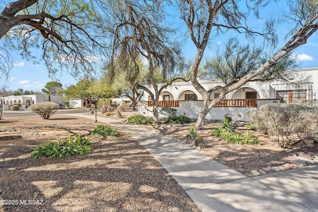 surrounding community with a fenced front yard