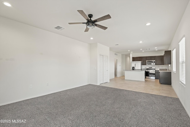 unfurnished living room with recessed lighting, visible vents, ceiling fan, and light colored carpet