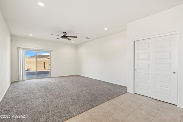 unfurnished room featuring visible vents, baseboards, light colored carpet, ceiling fan, and recessed lighting