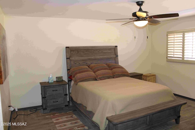 bedroom featuring a ceiling fan and baseboards