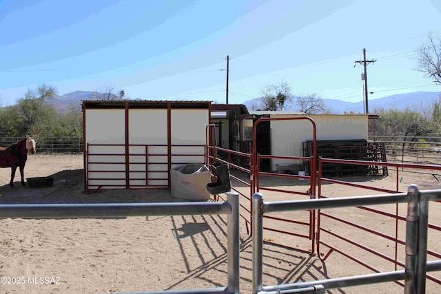 view of outdoor structure with an outbuilding, an exterior structure, and a mountain view