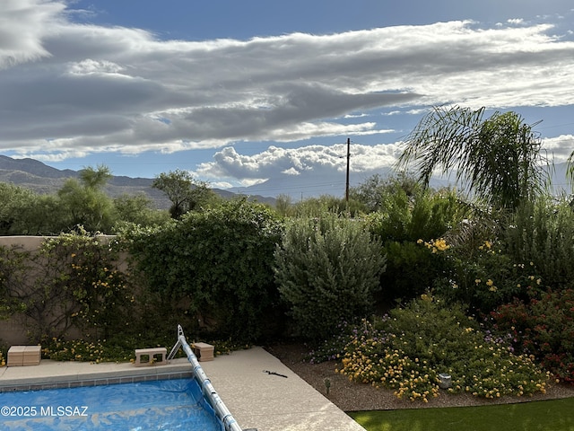 outdoor pool featuring a mountain view