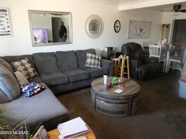 living room with ceiling fan and carpet flooring