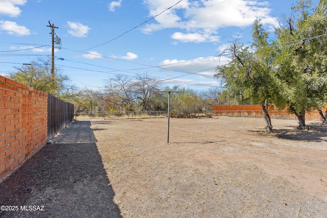 view of yard featuring fence