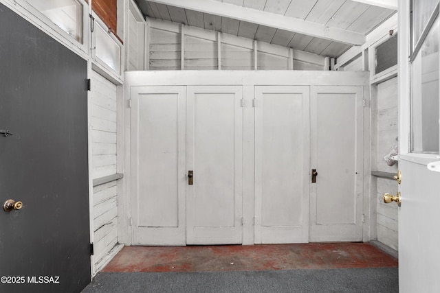 spacious closet featuring lofted ceiling with beams